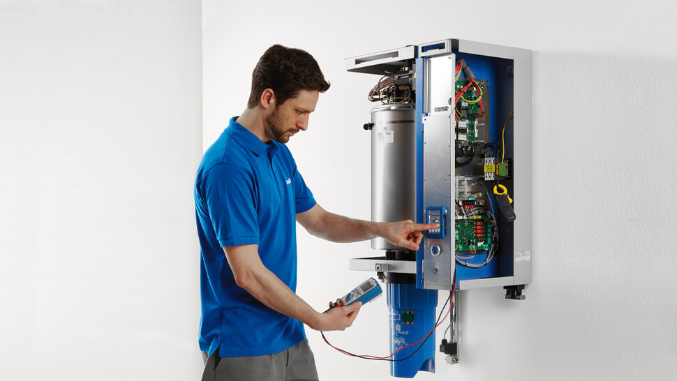 Condair mechanic servicing Condair RS unit